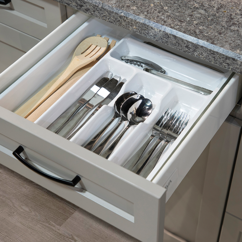 Open kitchen drawer with silverware